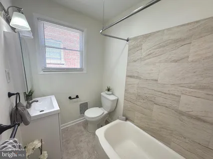 a bathroom with a sink and a toilet