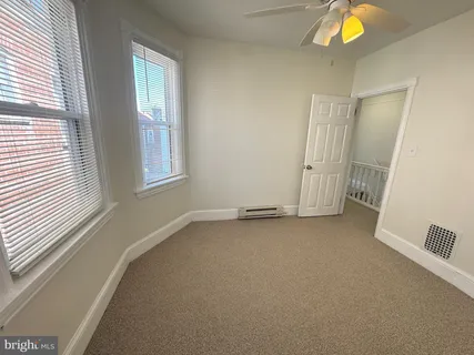 a view of an empty room with a window