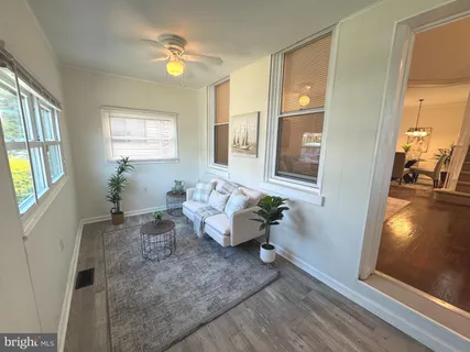a living room with furniture and a window
