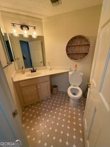 a bathroom with a sink a mirror and vanity