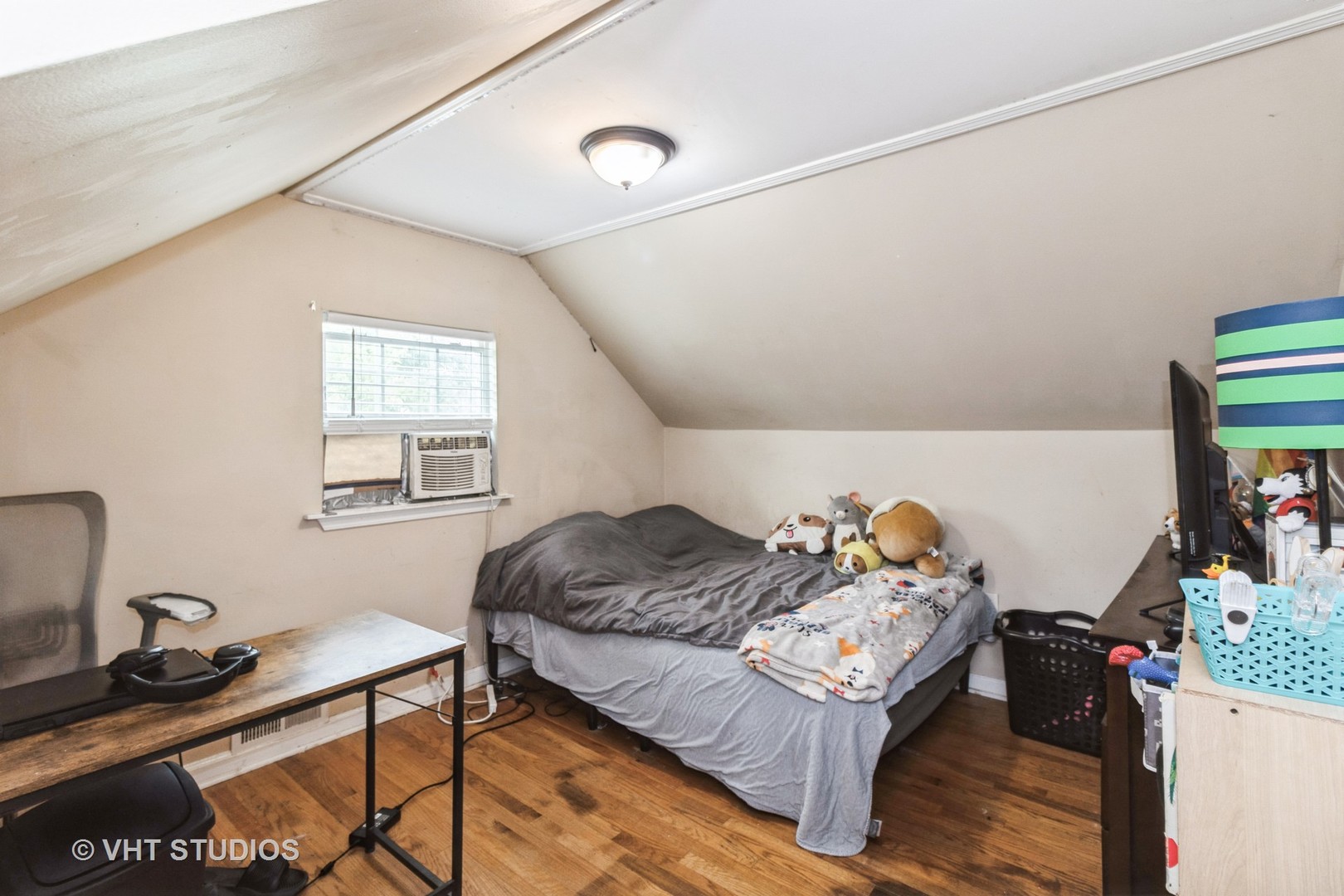 5037 Fargo Avenue Skokie, IL 60077 - Photo 13 of 20 a bedroom with a bed and wooden floor