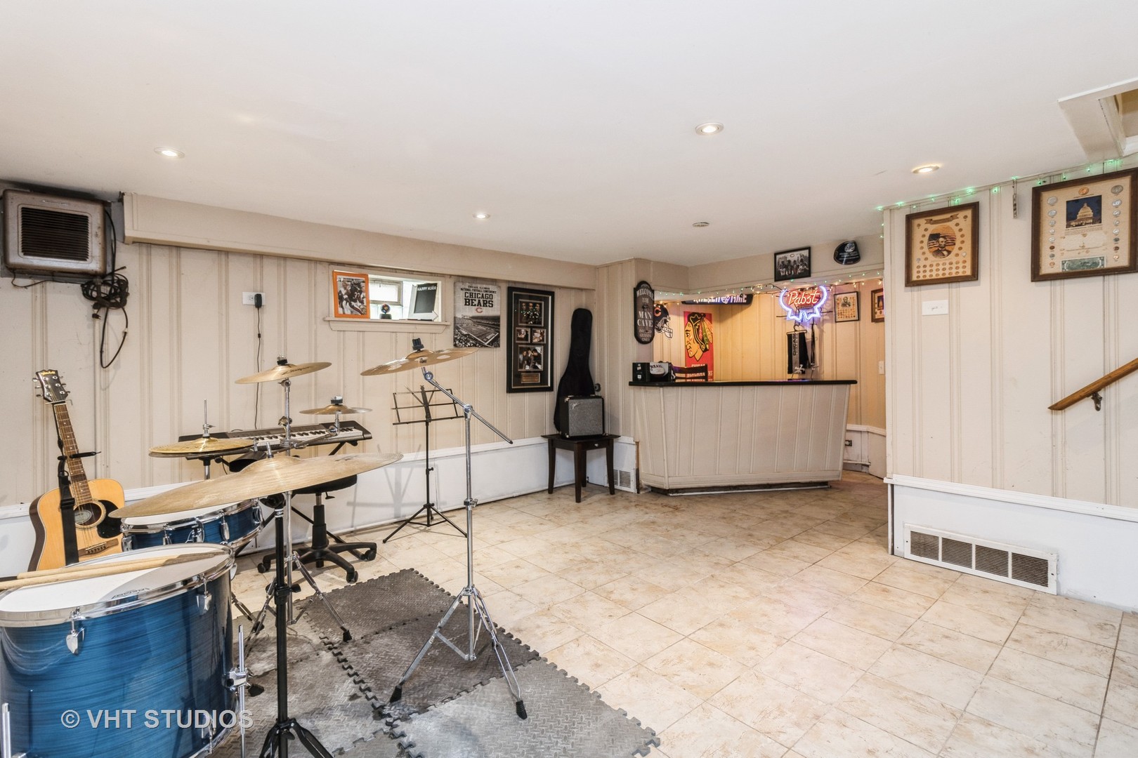 5037 Fargo Avenue Skokie, IL 60077 - Photo 16 of 20 a living room with furniture and a flat screen tv
