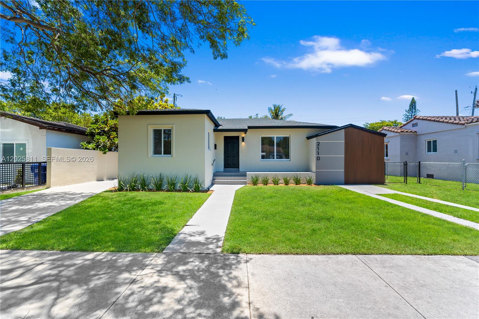 2110 Southwest 15th Street Miami, FL 33145 - Photo 2 of 37 front view of a house with a yard