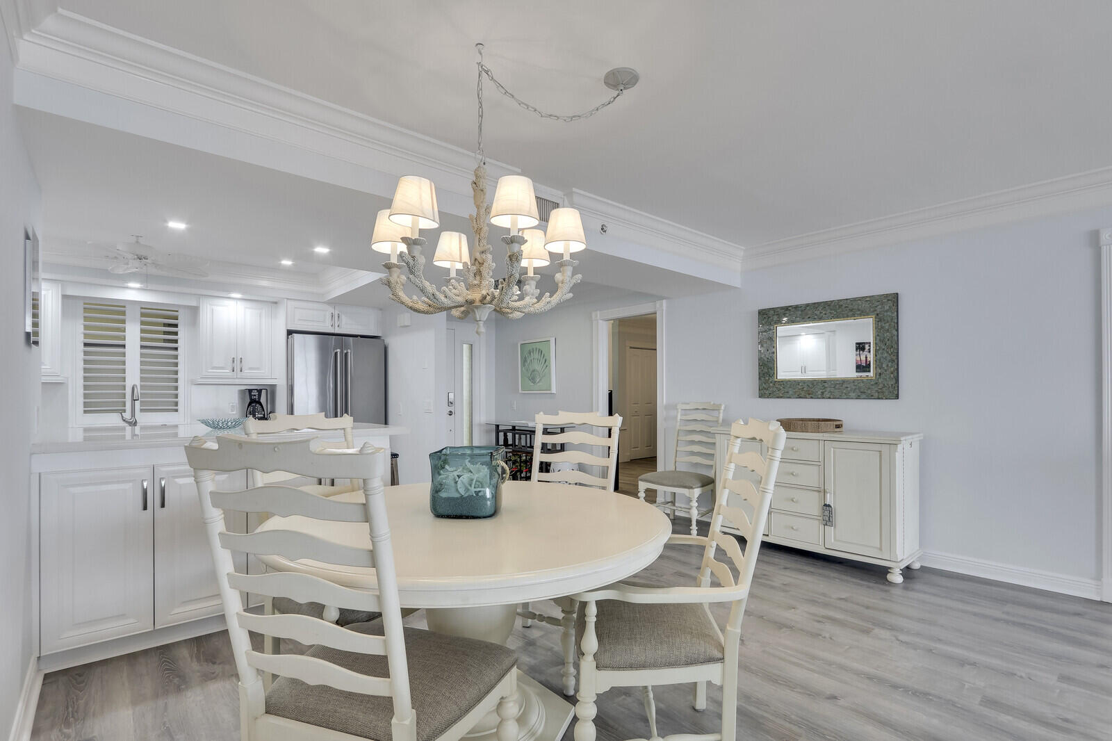 200 South Beach Road, Unit 802 Tequesta, FL 33469 - Photo 16 of 48 a view of a dining room with furniture and wooden floor