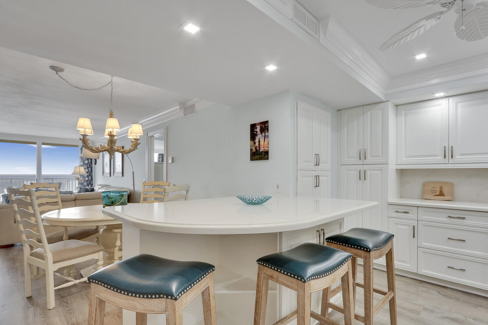 200 South Beach Road, Unit 802 Tequesta, FL 33469 - Photo 25 of 48 a kitchen with a table chairs stove and cabinets