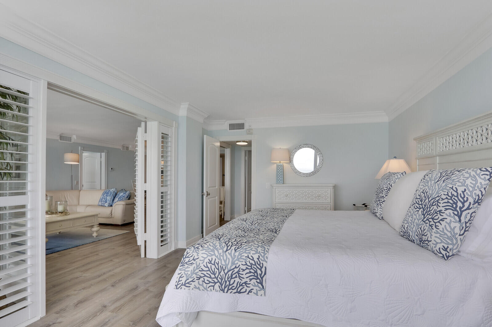 200 South Beach Road, Unit 802 Tequesta, FL 33469 - Photo 35 of 48 a bedroom with a bed and wooden floor