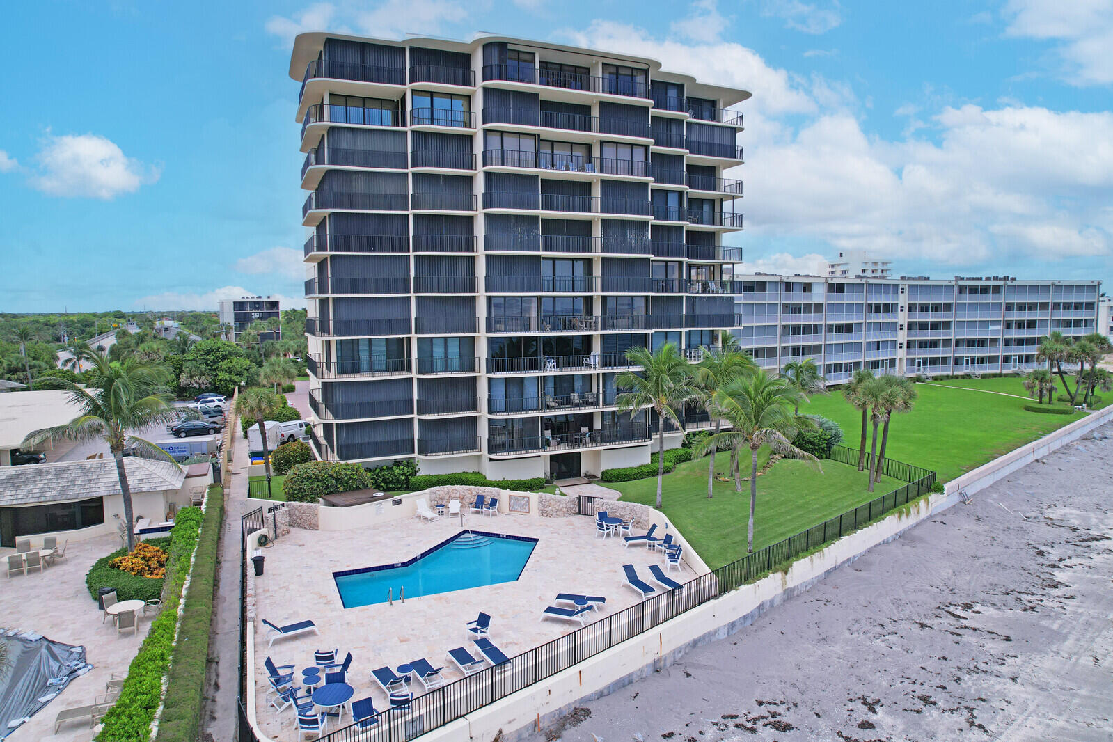 200 South Beach Road, Unit 802 Tequesta, FL 33469 - Photo 6 of 48 a view of a backyard with sitting area