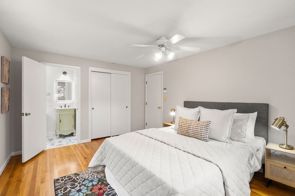 30 Hampton Road Sharon, MA 02067 - Photo 21 of 29 a bedroom with a large bed and a chandelier