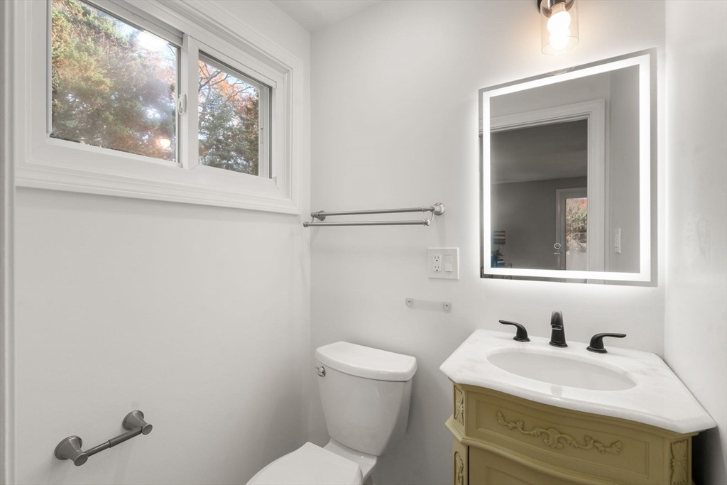 30 Hampton Road Sharon, MA 02067 - Photo 22 of 29 a bathroom with a sink a toilet and a window