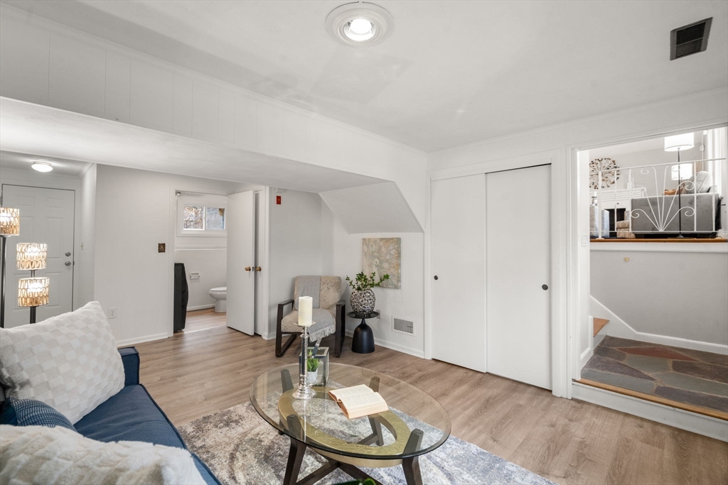 30 Hampton Road Sharon, MA 02067 - Photo 24 of 29 a living room with furniture and wooden floor