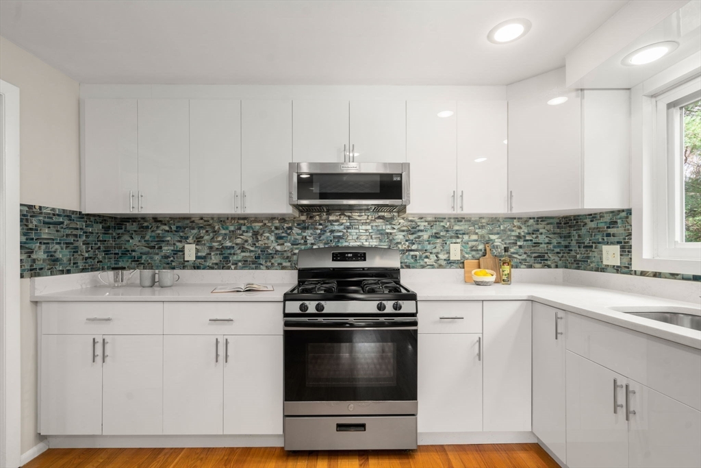 30 Hampton Road Sharon, MA 02067 - Photo 9 of 29 a kitchen with white cabinets and appliances