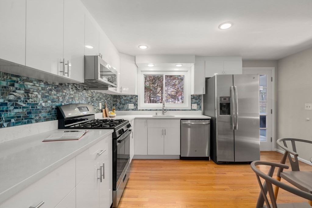 30 Hampton Road Sharon, MA 02067 - Photo 10 of 29 a kitchen with a stove a sink and a refrigerator
