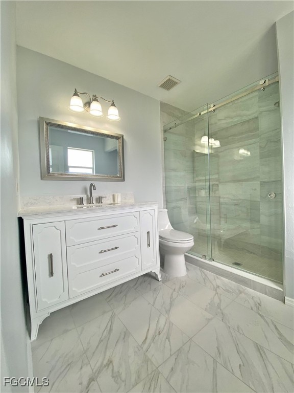 260 13th Street Southwest Naples, FL 34117 - Photo 11 of 29 a bathroom with a double vanity sink toilet and shower