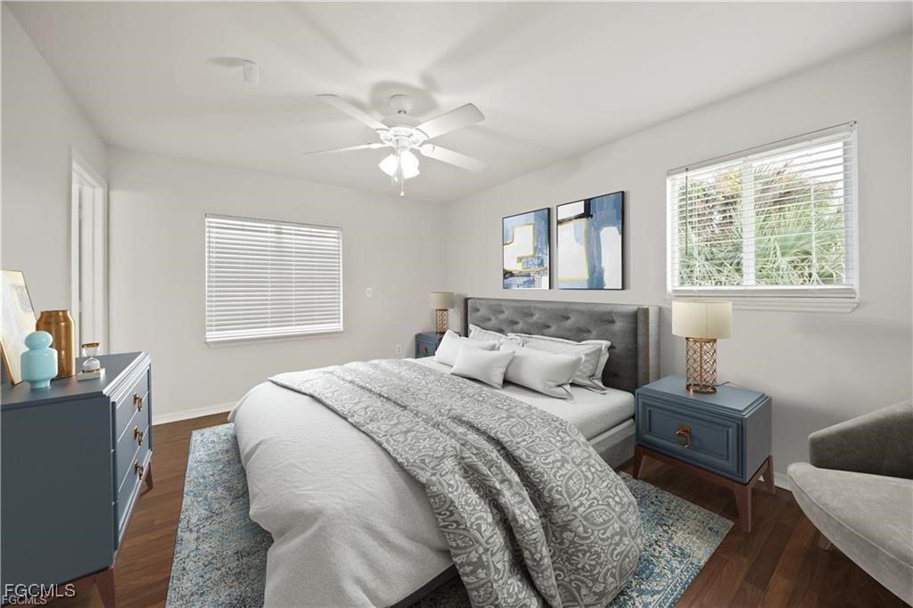 260 13th Street Southwest Naples, FL 34117 - Photo 12 of 29 a bedroom with a bed and a chandelier