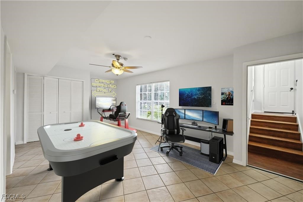 260 13th Street Southwest Naples, FL 34117 - Photo 15 of 29 a living room with furniture and a flat screen tv