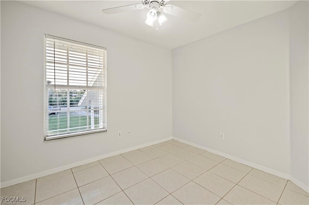 260 13th Street Southwest Naples, FL 34117 - Photo 17 of 29 an empty room with a window