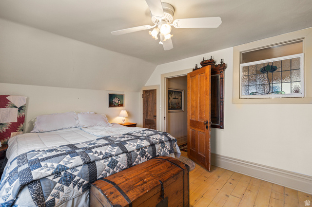 390 North 100 West Monroe, UT 84754 - Photo 82 of 167 Bedroom with light wood-style flooring, vaulted ceiling, and a ceiling fan