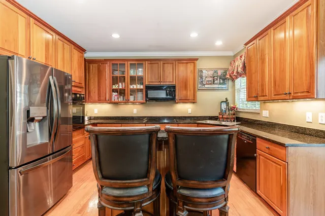 a view of a dining room with furniture and a window