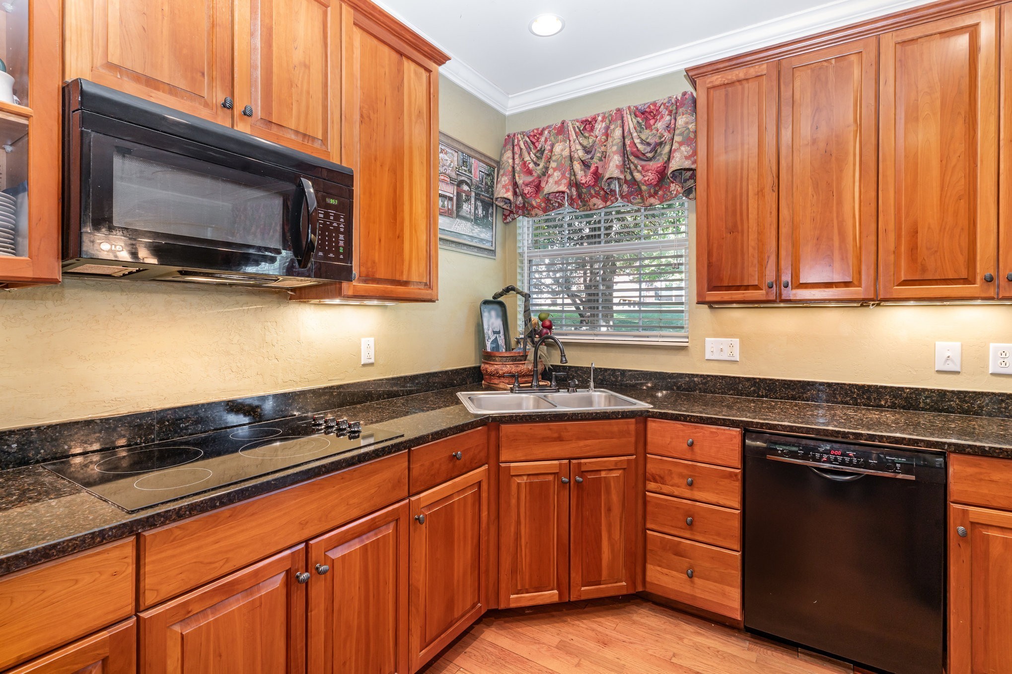 224 Logans Circle Franklin, TN 37067 - Photo 14 of 41 a kitchen with granite countertop stainless steel appliances a sink stove and microwave