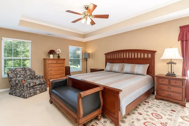 a bedroom with a bed and a fireplace