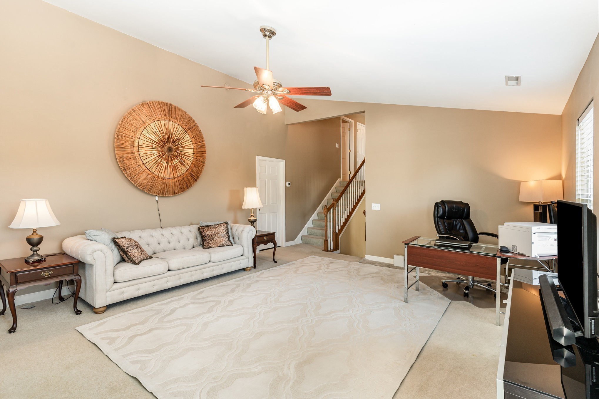 224 Logans Circle Franklin, TN 37067 - Photo 24 of 41 a living room with furniture a chandelier and a large window