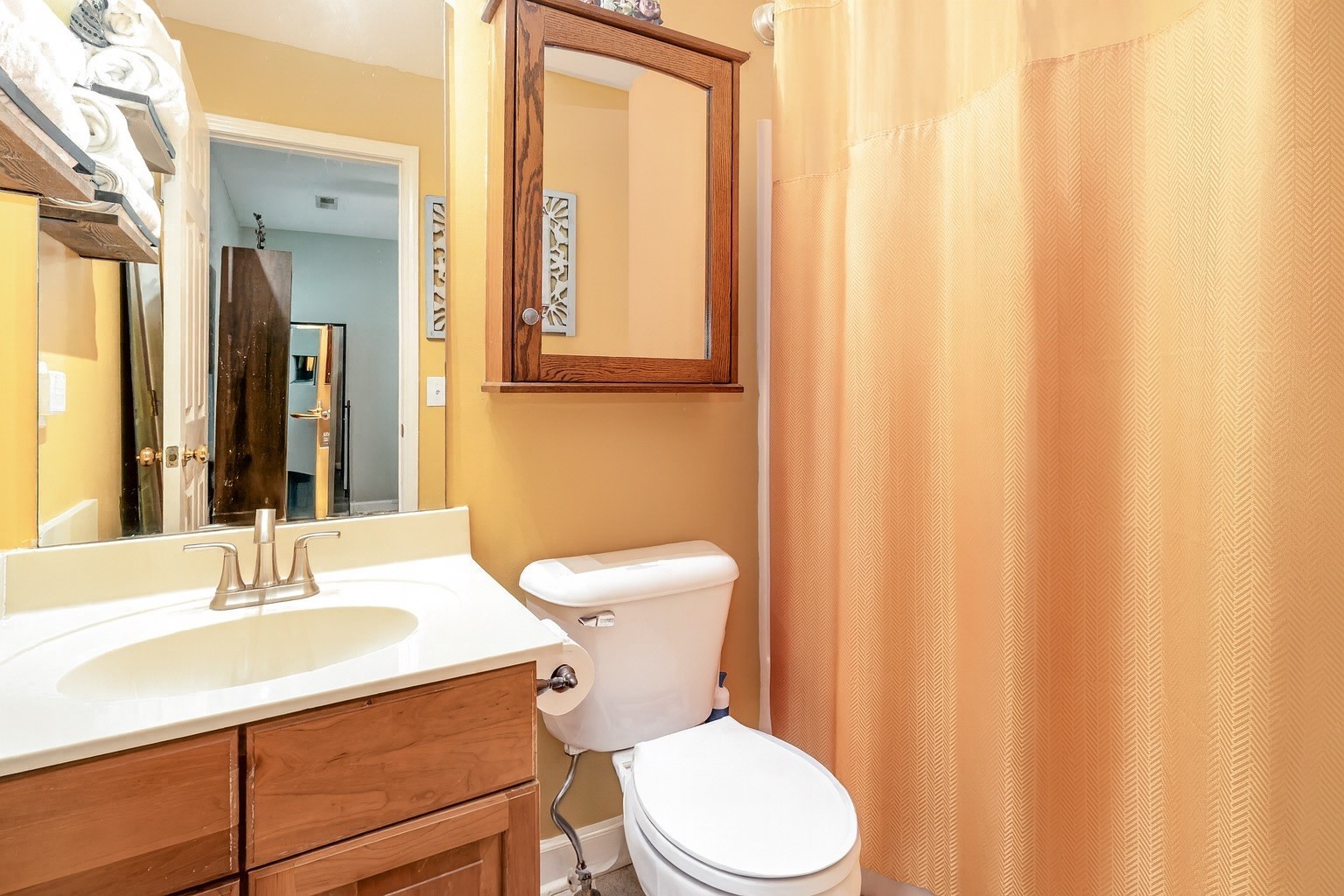 224 Logans Circle Franklin, TN 37067 - Photo 31 of 41 a bathroom with a sink a toilet and shower curtain