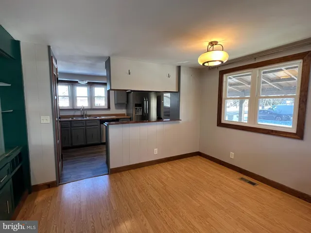 a kitchen with stainless steel appliances granite countertop a stove and a refrigerator