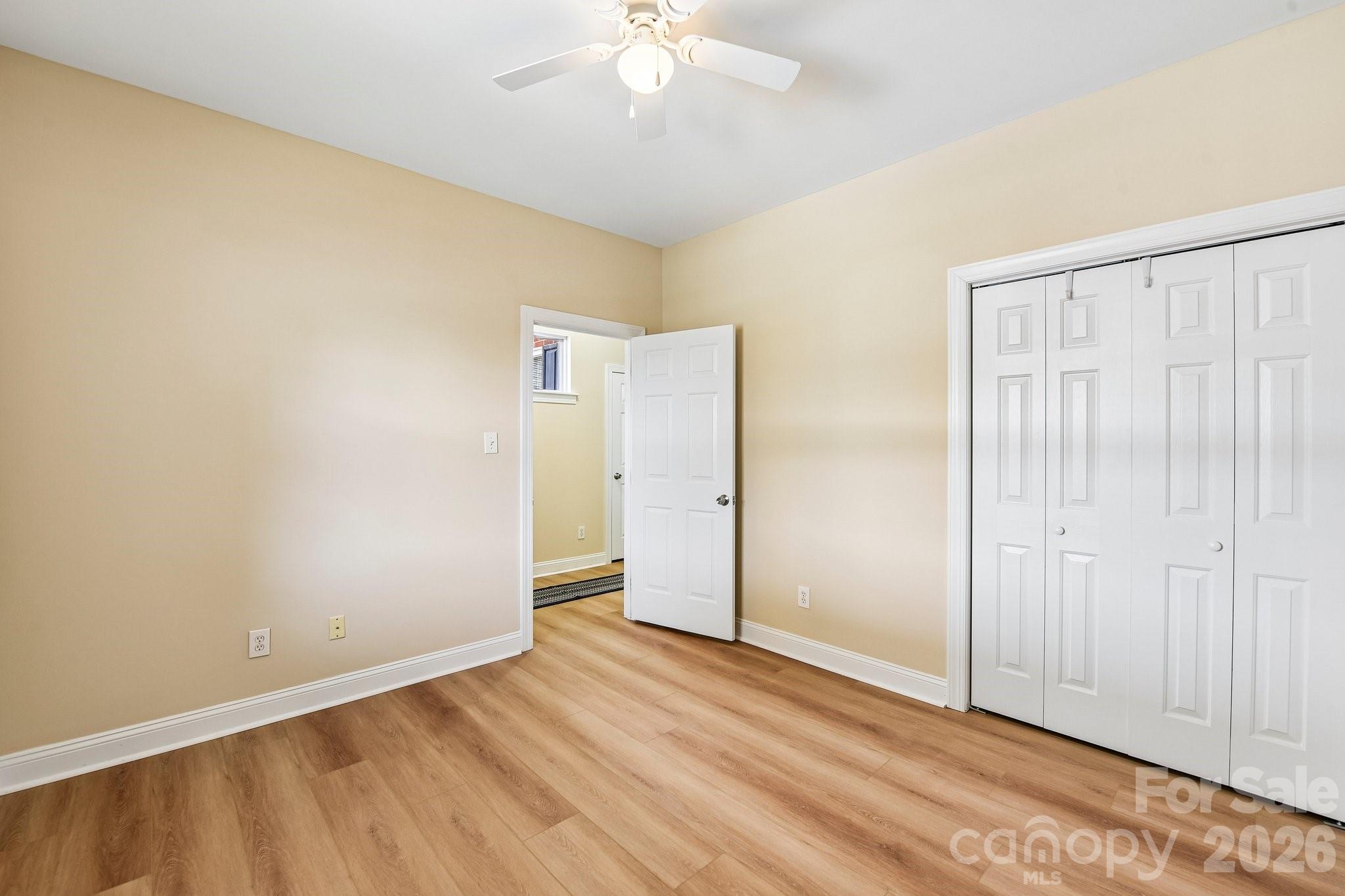 3854 Azalea Trail Denver, NC 28037 - Photo 12 of 22 a view of an empty room with wooden floor