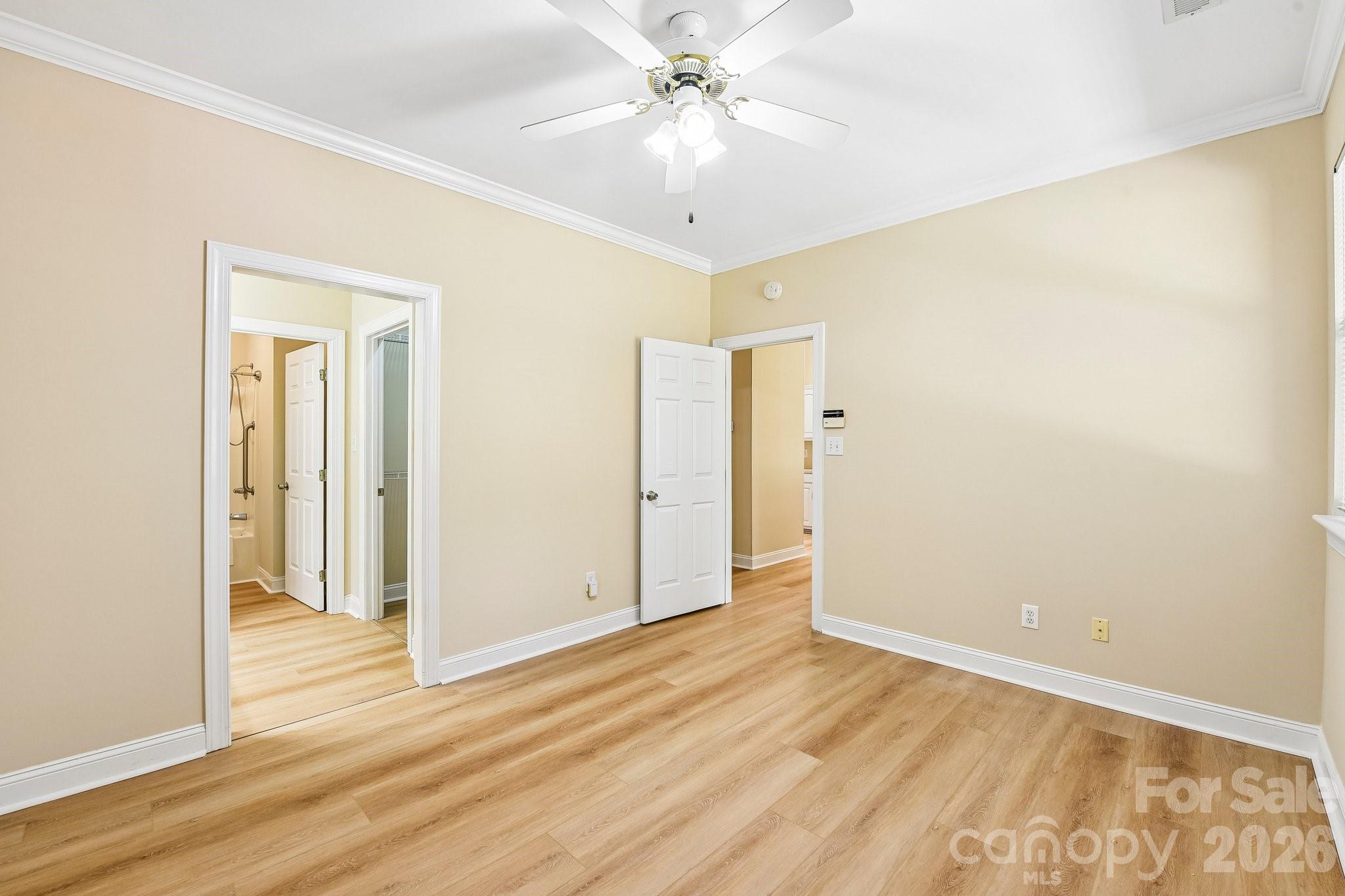 3854 Azalea Trail Denver, NC 28037 - Photo 16 of 22 a view of a room with wooden floor and a ceiling fan