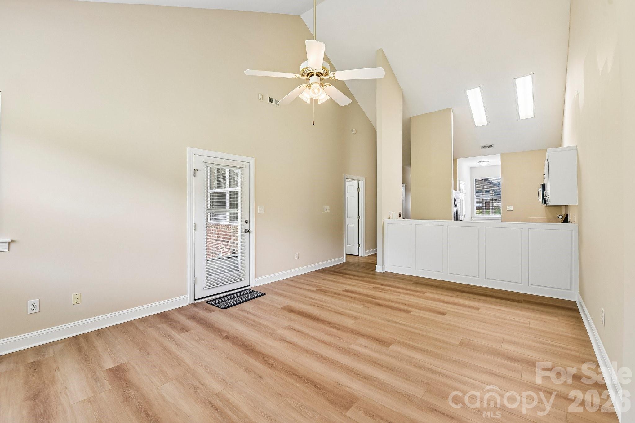 3854 Azalea Trail Denver, NC 28037 - Photo 4 of 22 a view of a livingroom with wooden floor and a ceiling fan