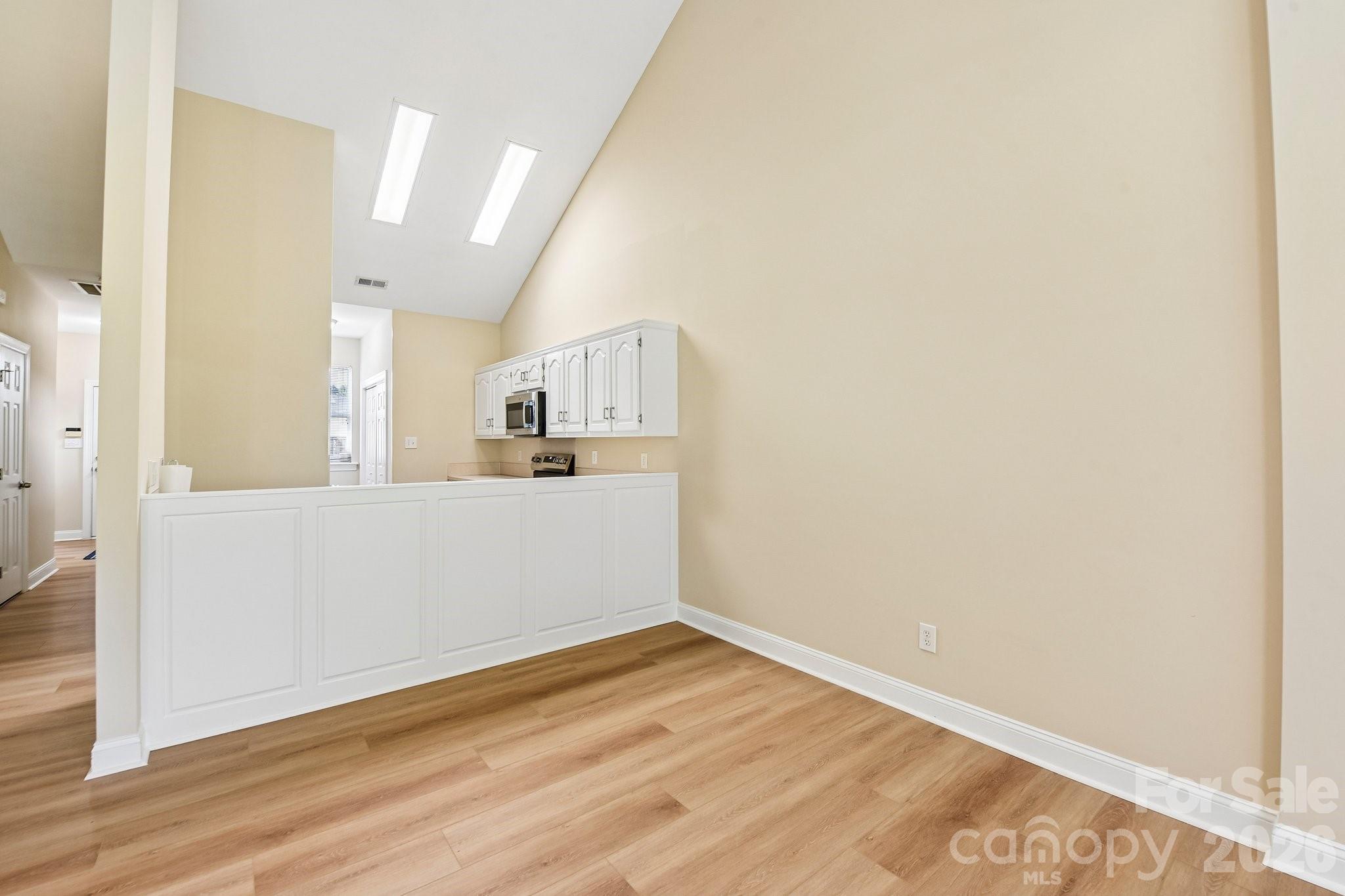 3854 Azalea Trail Denver, NC 28037 - Photo 6 of 22 a view of a kitchen with wooden floor