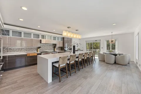 a large white kitchen with lots of counter space