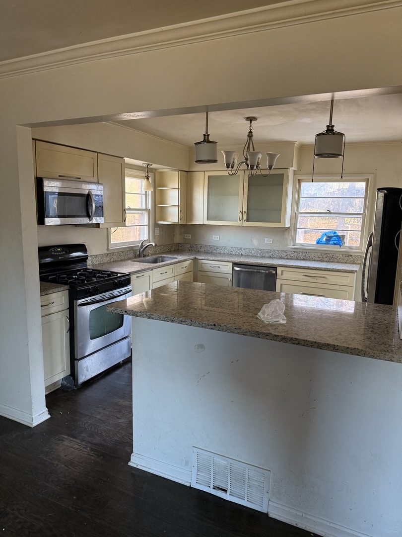 35049 North Edgewater Lane Ingleside, IL 60041 - Photo 3 of 9 a kitchen with stainless steel appliances a sink and a stove