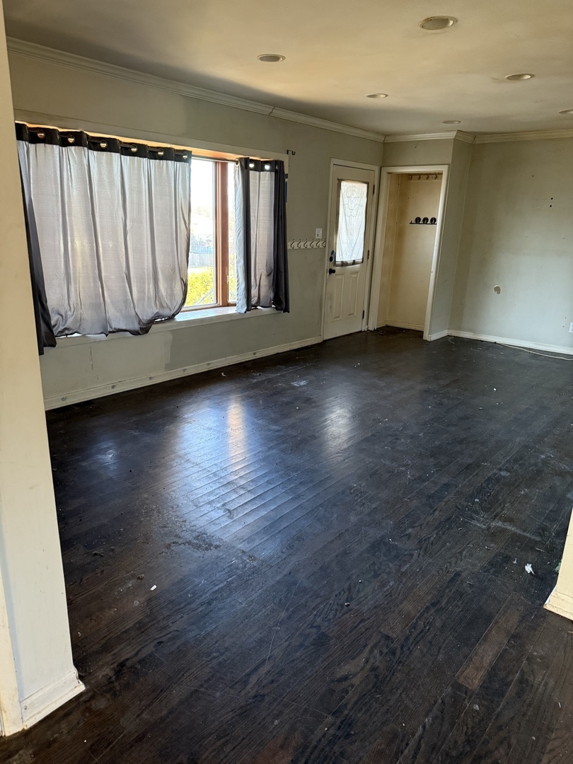 35049 North Edgewater Lane Ingleside, IL 60041 - Photo 6 of 9 an empty room with wooden floor and windows