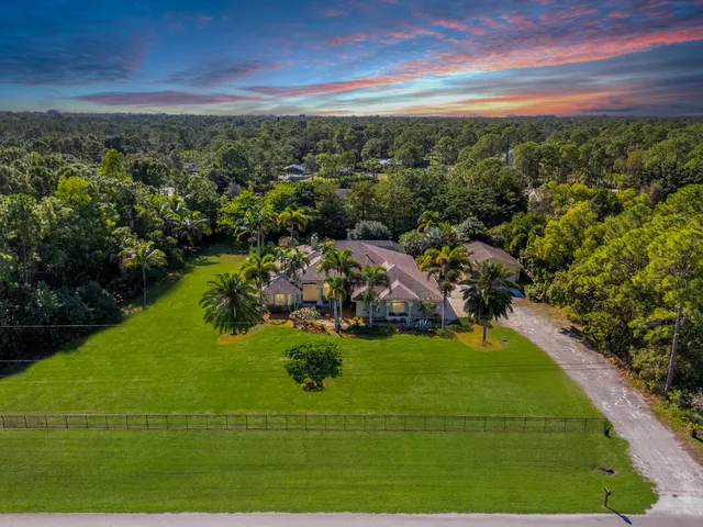a view of a swimming pool with a garden