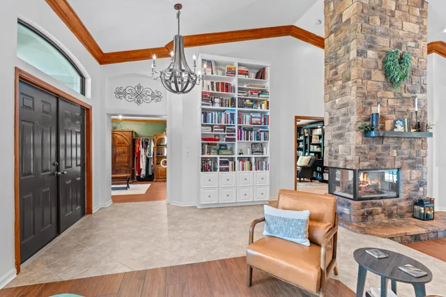 a bathroom with a granite countertop sink a toilet a mirror a vanity and shower