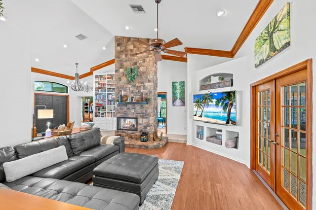 a kitchen with stainless steel appliances granite countertop a sink a stove and a microwave