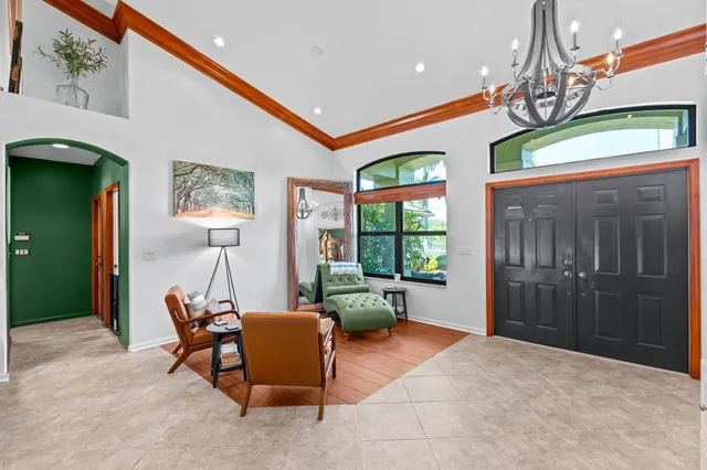a spacious bathroom with a tub sink and mirror