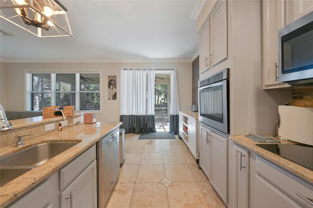 10007 Winding River Road Punta Gorda, FL 33950 - Photo 12 of 44 a large kitchen with a sink and cabinets