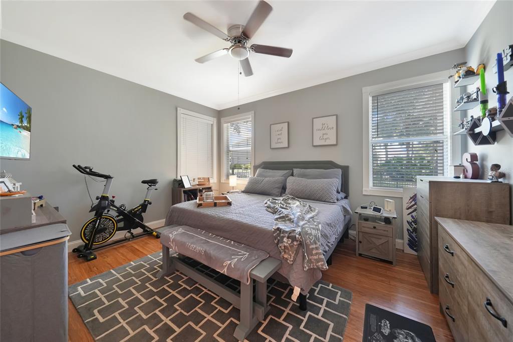 10007 Winding River Road Punta Gorda, FL 33950 - Photo 15 of 44 a bedroom with a bed and a chandelier