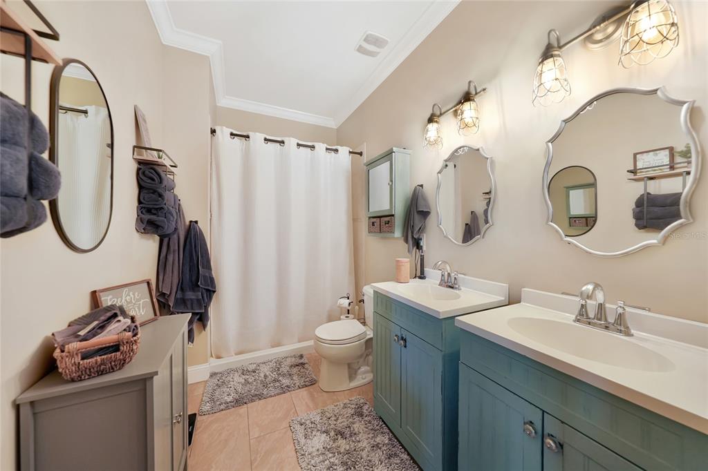 10007 Winding River Road Punta Gorda, FL 33950 - Photo 18 of 44 a bathroom with a sink a toilet and a mirror