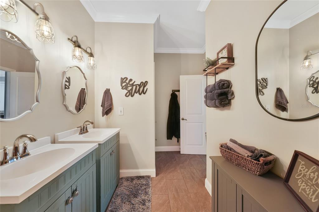 10007 Winding River Road Punta Gorda, FL 33950 - Photo 19 of 44 a bathroom with a sink mirror and tub