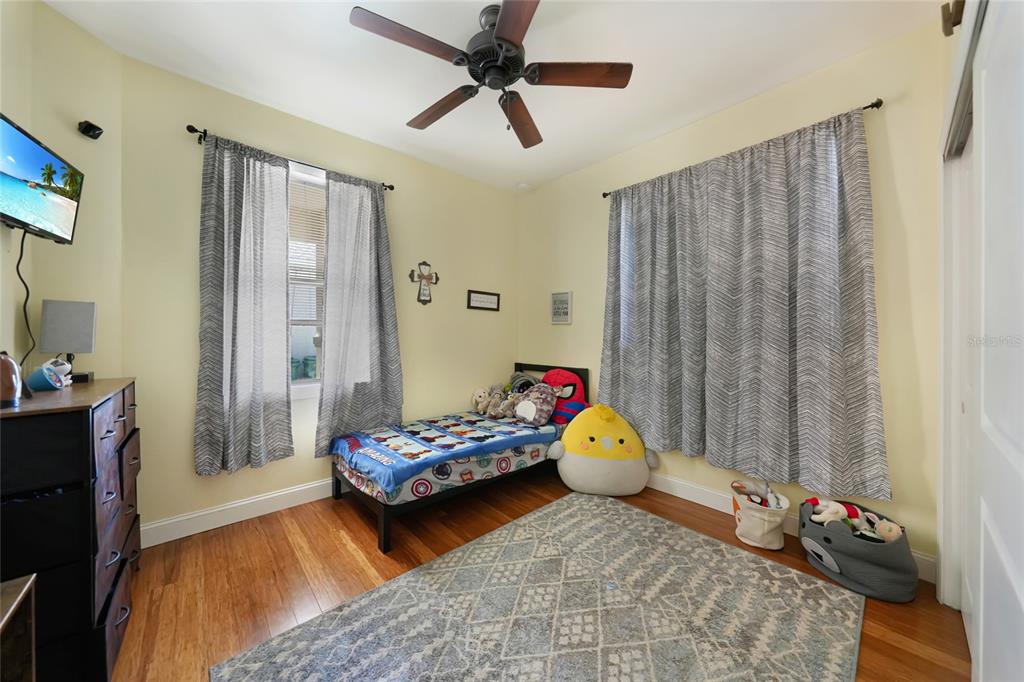 10007 Winding River Road Punta Gorda, FL 33950 - Photo 21 of 44 a bedroom with furniture and a window
