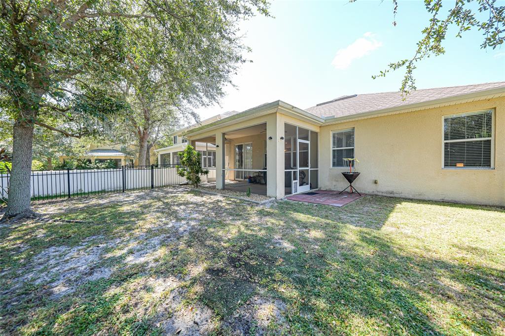 10007 Winding River Road Punta Gorda, FL 33950 - Photo 35 of 44 a view of a house with backyard and a tree