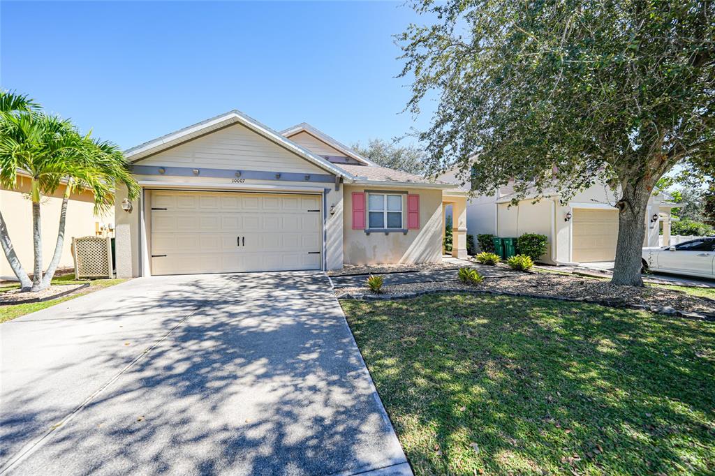 10007 Winding River Road Punta Gorda, FL 33950 - Photo 41 of 44 a front view of a house with garden
