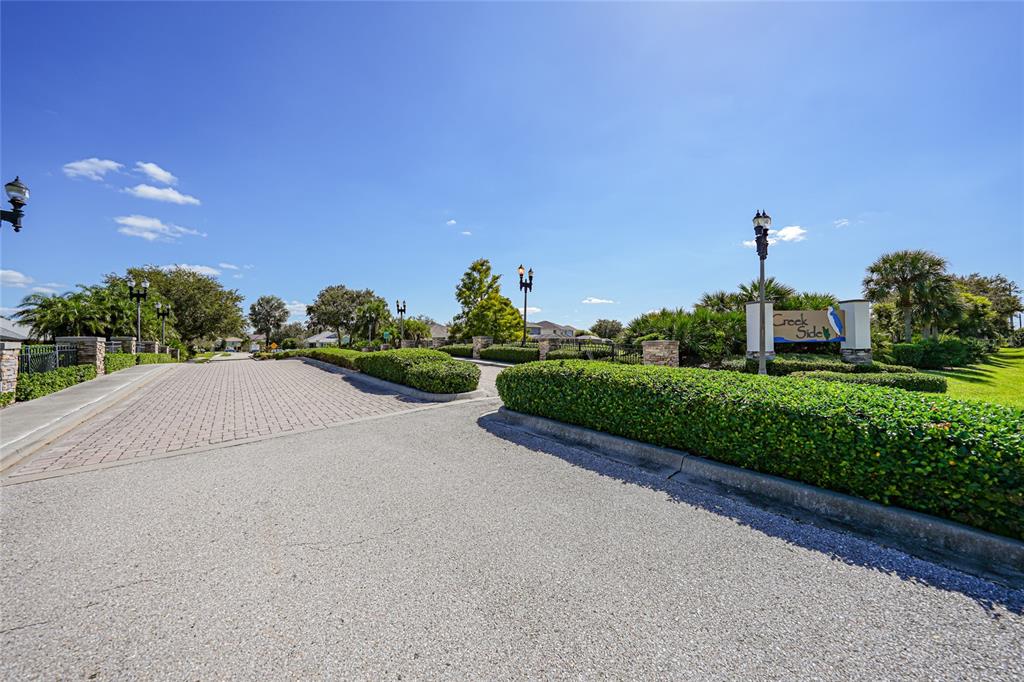 10007 Winding River Road Punta Gorda, FL 33950 - Photo 43 of 44 a view of a street with a houses in the background