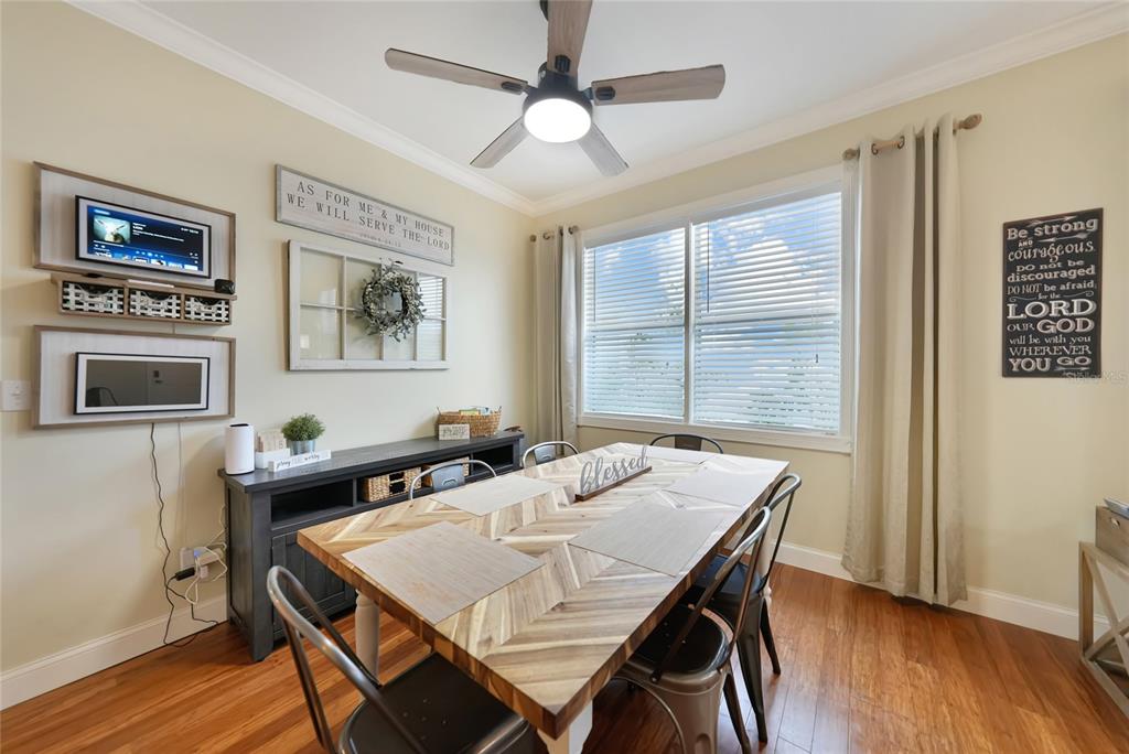 10007 Winding River Road Punta Gorda, FL 33950 - Photo 7 of 44 a view of a dining room with furniture window and wooden floor