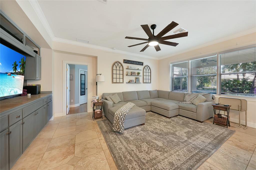 10007 Winding River Road Punta Gorda, FL 33950 - Photo 8 of 44 a living room with furniture and a large window