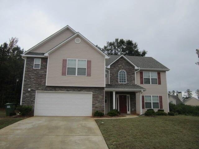 573 Ridgeview Court Monroe, GA 30655 - Photo 1 of 1 a front view of a house with a yard and garage