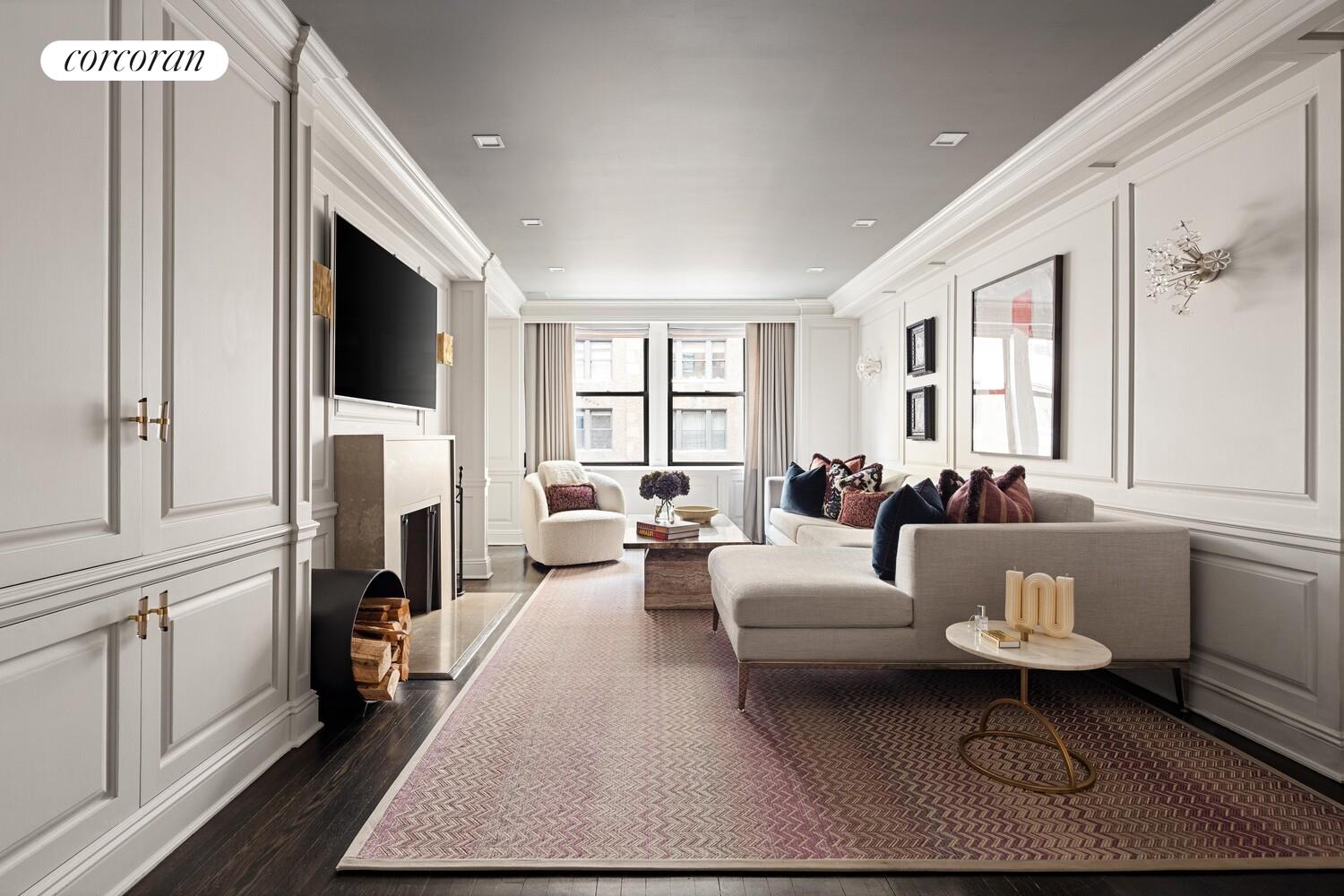 220 East 73rd Street, Unit 6D Manhattan, NY 10021 - Photo 4 of 19 a living room with furniture a fireplace and a flat screen tv